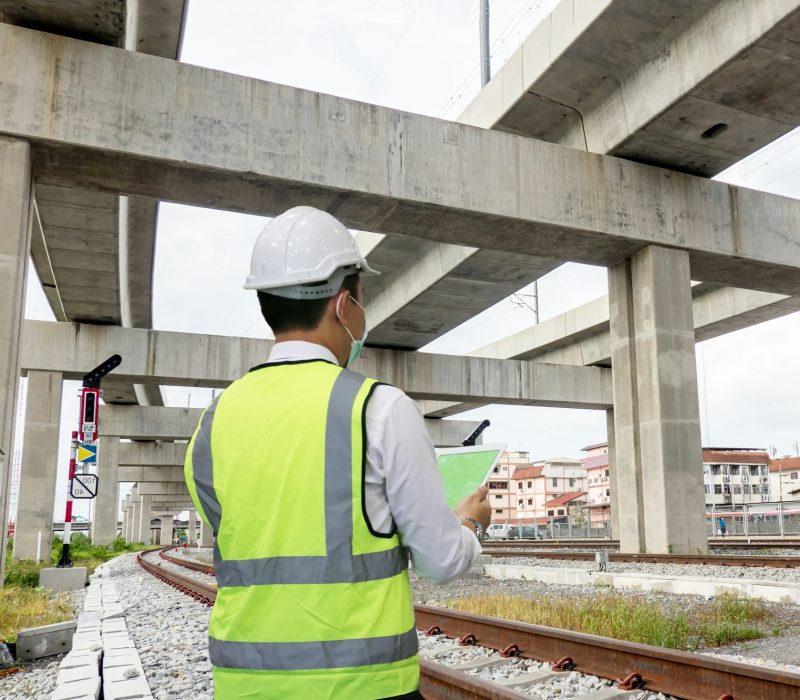 inspection engineer is checking on infrastructure and construction site.